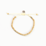 Coconut wood bead bracelet with adjustable cord and button clasp.