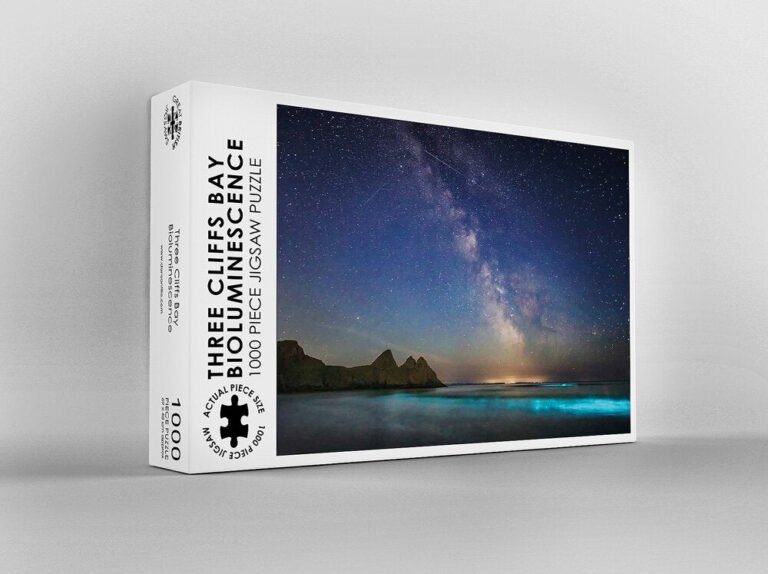 Dan Santillo jigsaw puzzle featuring Three Cliffs Bay under a starry night sky.