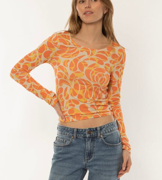 Sisstrevolution Skyscape LS Knit in coral with vibrant abstract print, front view.