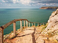 Dan Santillo greeting card featuring a scenic cliff path overlooking the sea.