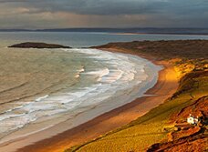 Dan Santillo greeting card featuring a scenic view of Llangennith beach.