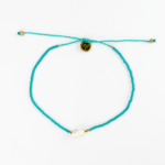 Turquoise beaded shell anklet with adjustable cord and gold accents.