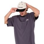 Rusty Competition short sleeve tee styled with a cap, showcasing casual look.