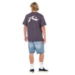 Full back view of Rusty Competition short sleeve tee paired with denim shorts.