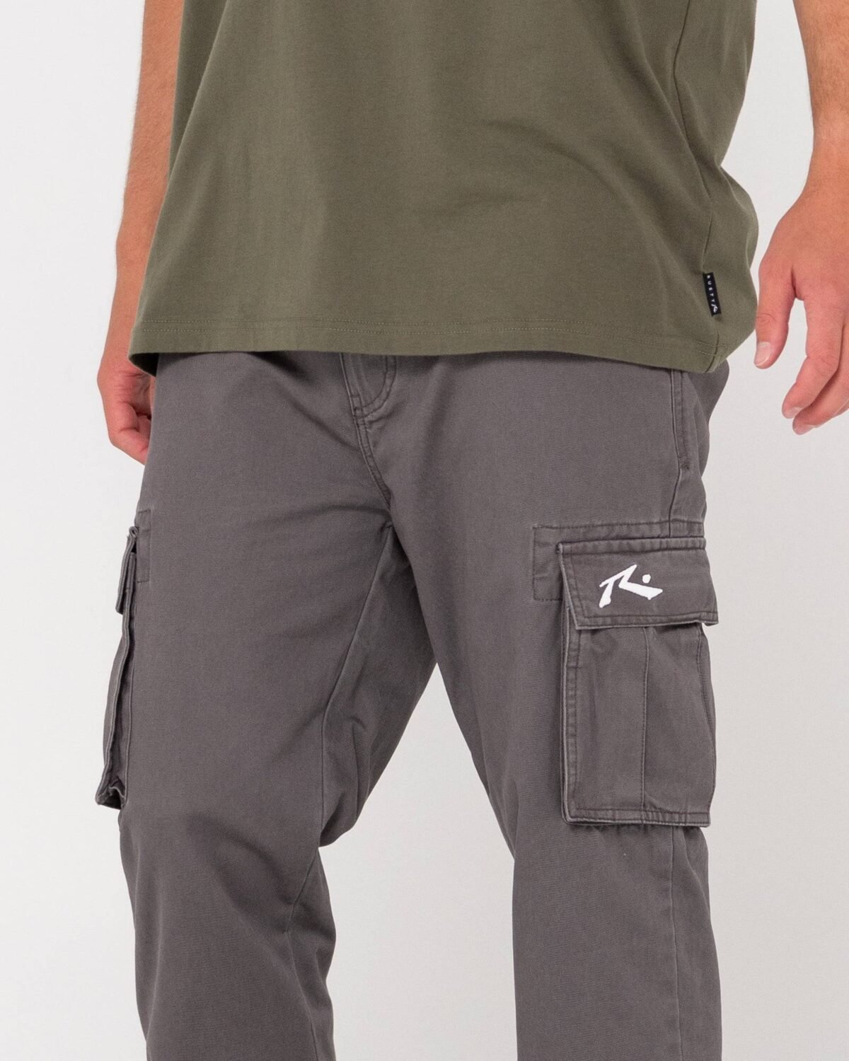 Rusty Manila Cargo Pant close-up of side cargo pocket with logo.