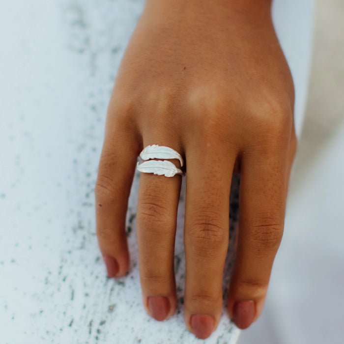 Silver Bocca Feather Ring by Pineapple Island worn on a hand.
